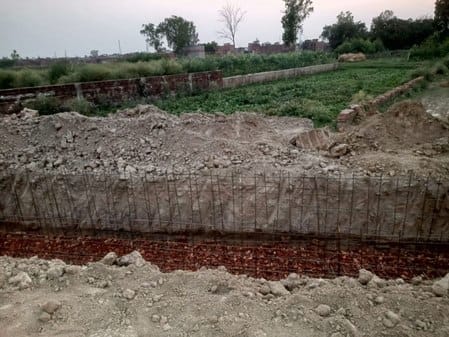 The municipality is constructing a drain on the farmer's land