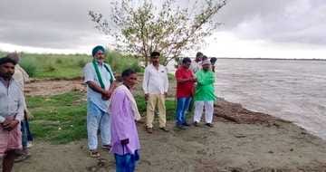 A house submerged in Sharda river in Ghosiana
