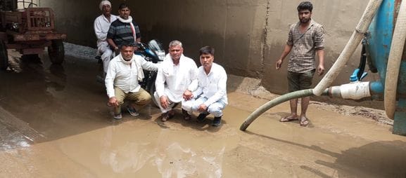 Protested by sitting in water filled underpass