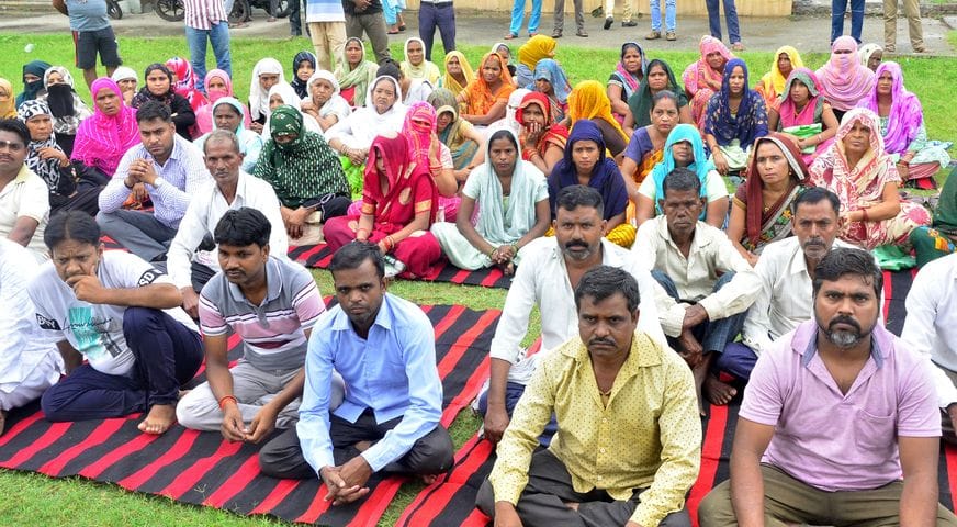 Advocates and investors sit on dharna against the directors of Amar Jyoti