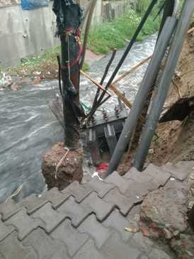 Transformer fell into the drain due to rain