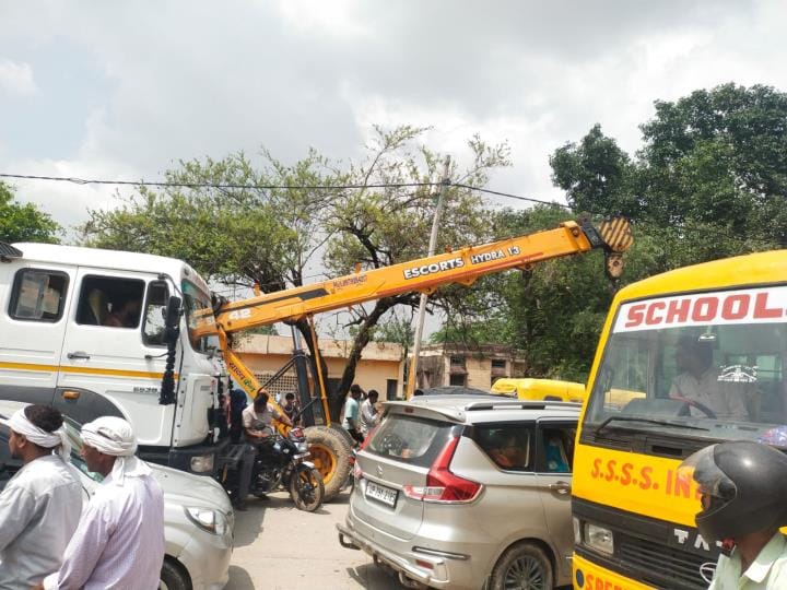The overloaded truck got stuck and caused a two hour traffic jam