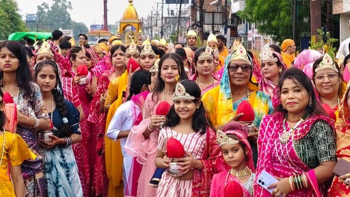Women wearing yellow clothes took out Kalash Yatra