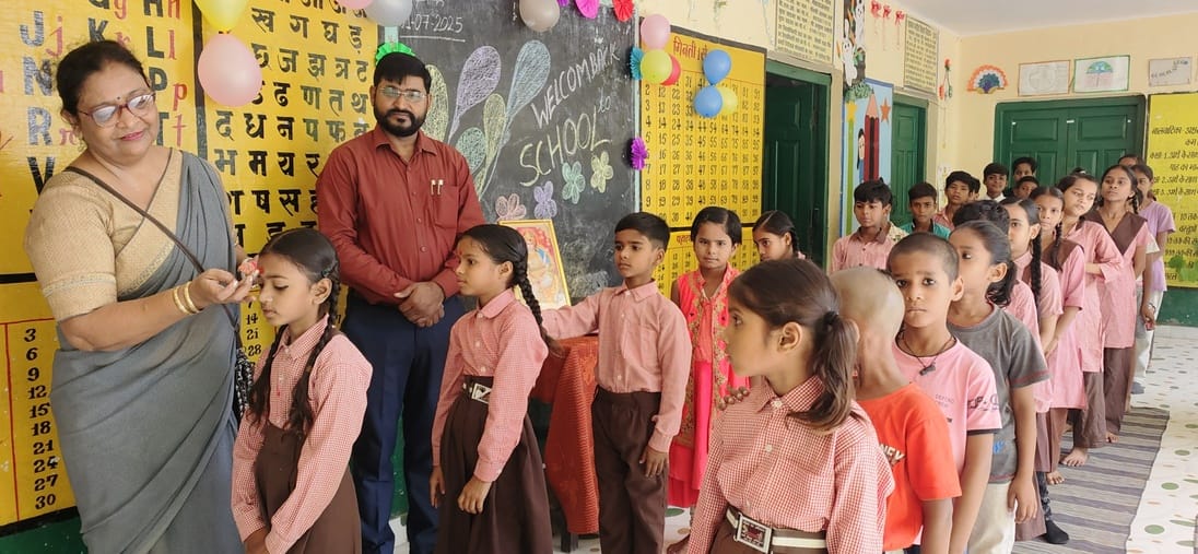 Welcome the children in schools by applying tilak