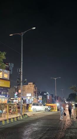 Lights are off on the main road of the city, drivers pass in the dark