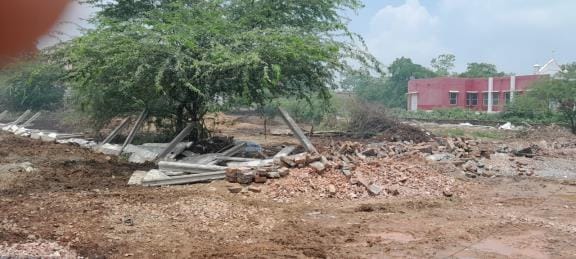 The corporation demolished the wall built on the land without division