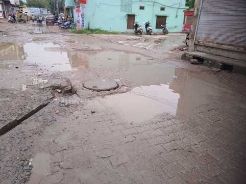 Waterlogging in front of shops due to sewer overflow