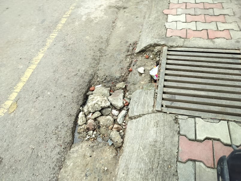 The footpath built three months ago was broken, the road was also uprooted, potholes were formed again