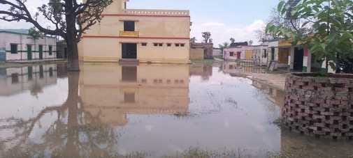 Children are forced to go to school through water