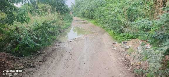55 potholes on the four kilometer road from Dhumai to Raghunathpur