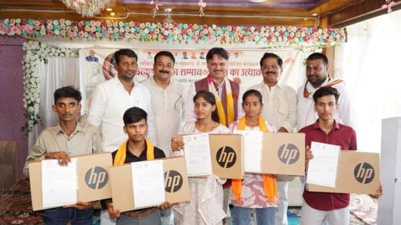 Gift of laptop and bicycle to meritorious students, social workers also honoured