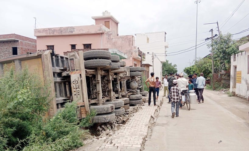 The truck lost control and overturned while trying to avoid a high tension wire