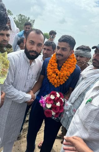 Naveen Goyat welcomed after returning to village after winning gold and silver from America