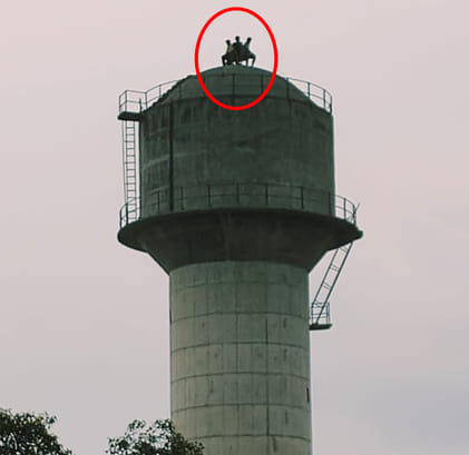 Three youths climbed a 120 feet high tank to make a reel