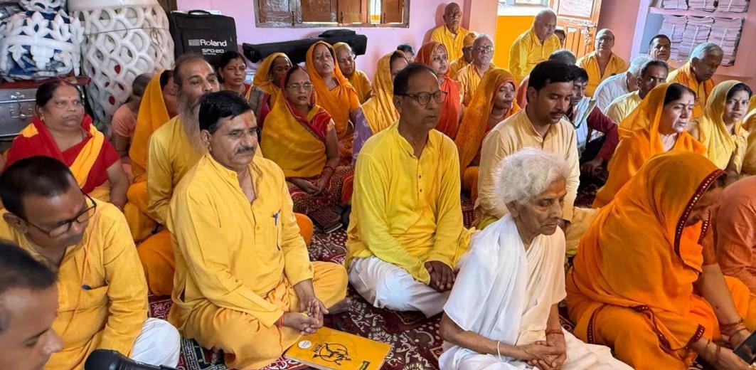 Bowing head at the feet of Gurus