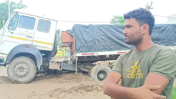 Overloaded truck stuck in a deep pit in Ladayan