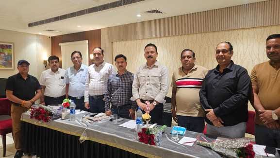 electricity officers meeting with businessmen