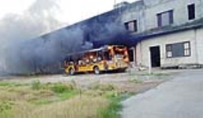 A private school bus parked in a playground caught fire