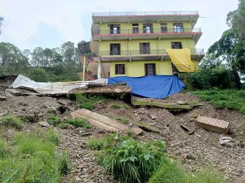 Danger of collapse of three storey house due to landslide