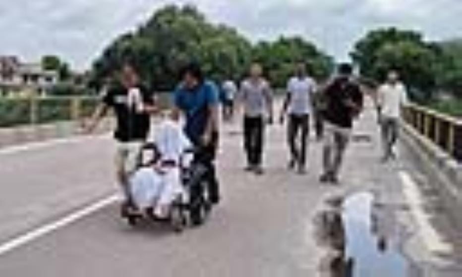 The referred patient was made to cross the Yamuna bridge in a wheel chair