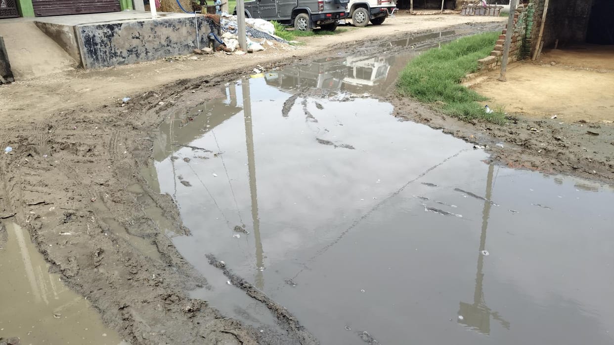 Water flowing on the road due to clogged drain