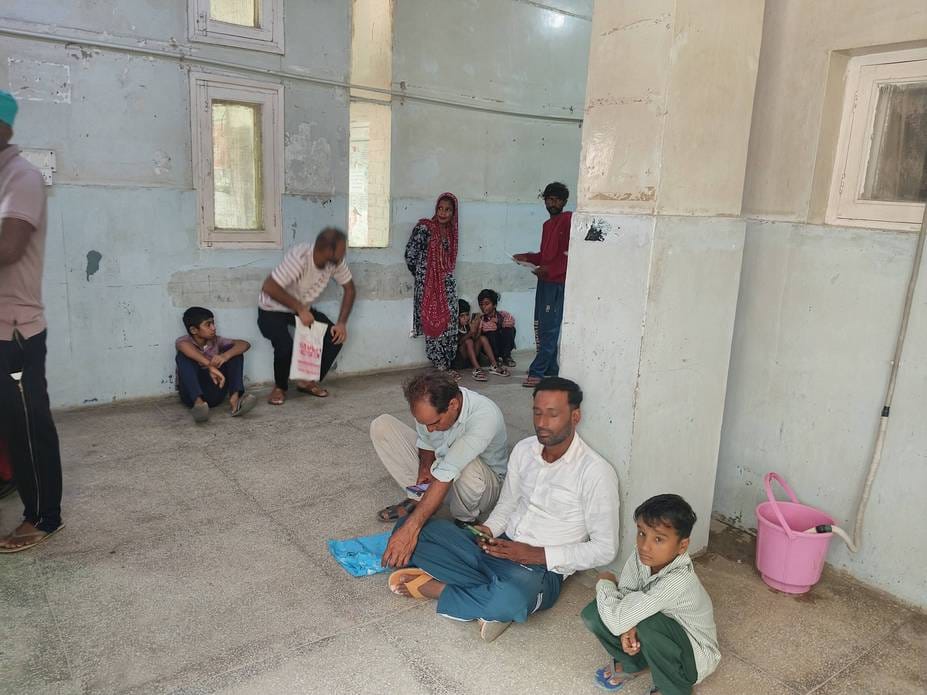 There is no seating arrangement outside the specialist room, people sat on the ground and waited for their turn