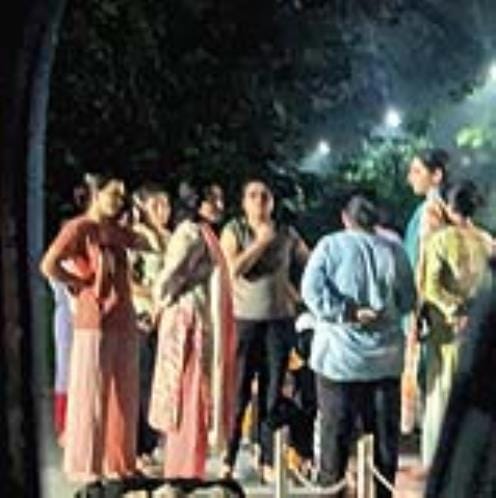 Students protest against the fee hike at the working women's hostel.