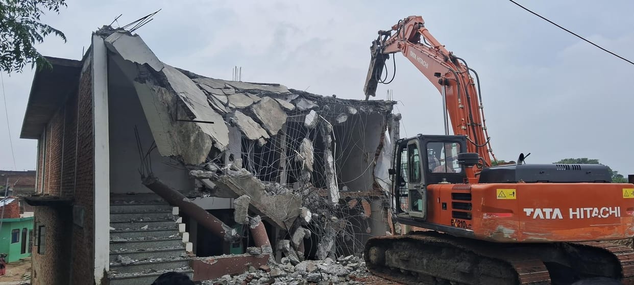 JCB runs on a house built on government land