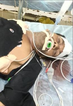 Laborer injured in truck collision, attempted to block road