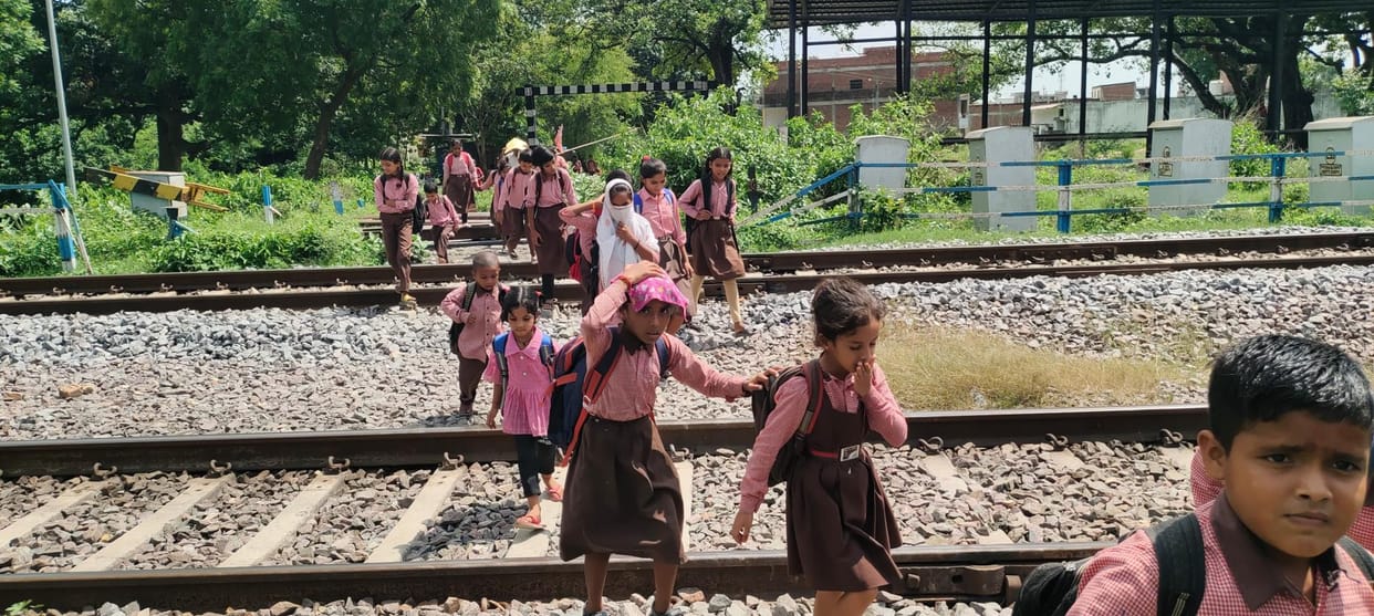 Water filled in the underpass, children crossing the railway track risking their lives