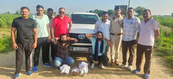 Three pistols and 18 cartridges were recovered from two youths travelling in a car