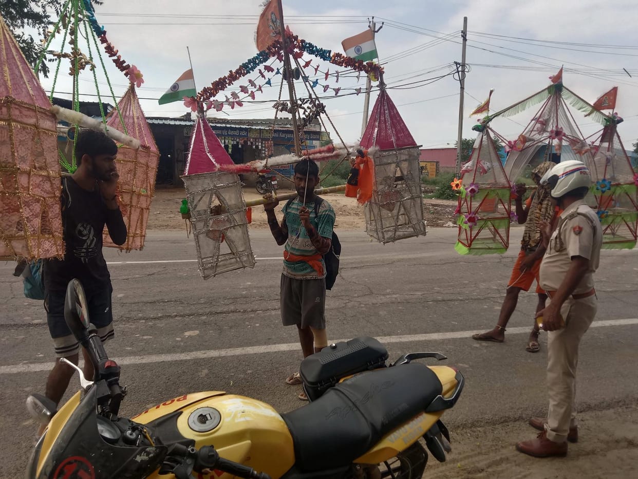 Police is asking Kanwariyas about their well-being and helping them cross the road amid security