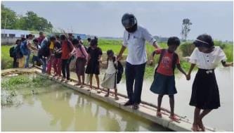 The path of education is very difficult... children are crossing the canal risking their lives