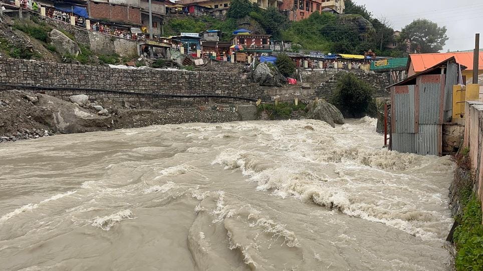Alaknanda flowing in spate in Badrinath, Ghat submerged