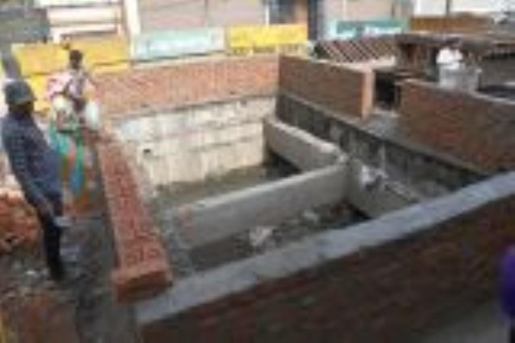 The barricading was removed and a brick wall was raised around the drain
