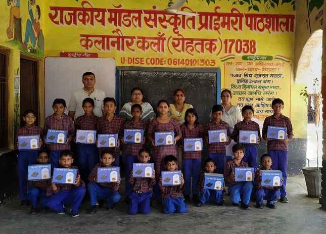 Stationery distributed to children in government school of Kalanaur Kalan