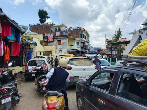 Due to lack of parking, vehicles are parked on the roads in Bedinag Nagar.