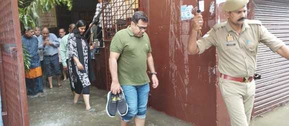DM inspected the dirty water, Commissioner came down with his shoes in his hand