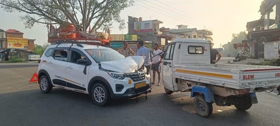 Auto overturned in the middle of the road due to collision with a car