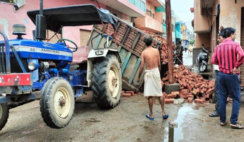 Road sunken due to tractor trolley filled with bricks on Oil Mill Road, anger