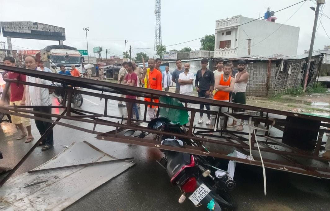Heavy rain after storm, indicator fell on highway, pedestrian got trapped under it and injured