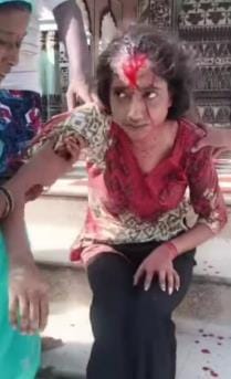 A lunatic shot three bullets at a student who was praying in a temple