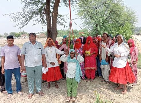 Elderly women sang Teej songs while swinging on a swing