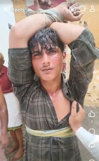 The thief was tied to a pole and beaten