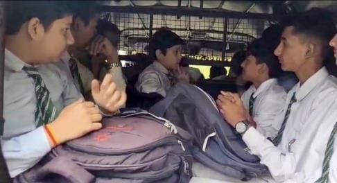 22 passengers. 20 students. stuffed. eight-seater taxi.
