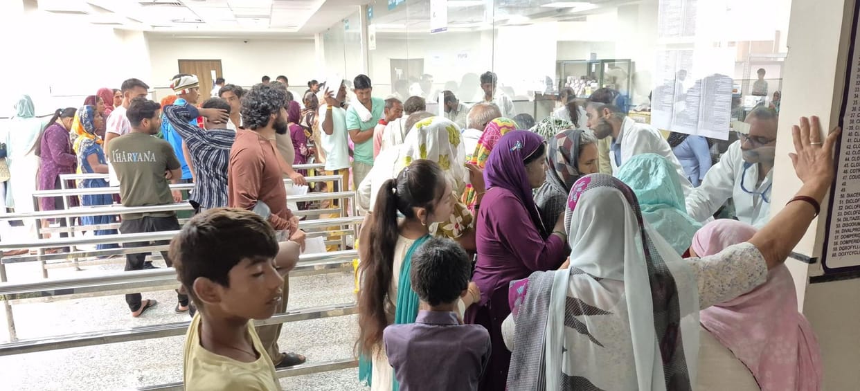 Long queues of patients are seen at the only medicine distribution centre of the medical college building