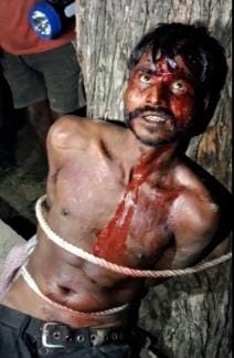 A young man was tied to a tree and beaten on suspicion of theft