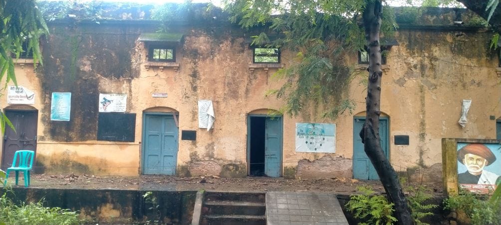 The dilapidated school is closed...classes are held in the 4 rooms next to it, water drips here too