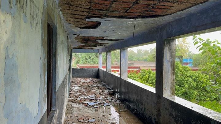 Chaos peeking out from the roof in a dilapidated school