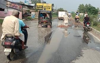PWD left the road after filling the potholes with bricks